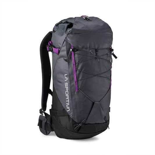 The La Sportiva Granite 32 Backpack is gray and black with purple accents, adjustable shoulder straps, a padded waist belt, and features external bungee cords on the front.