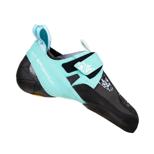 A side view of the La Sportiva Skwama Vegan Women's climbing shoe in turquoise and black, featuring a Velcro strap and reinforced toe, shown against a white background.