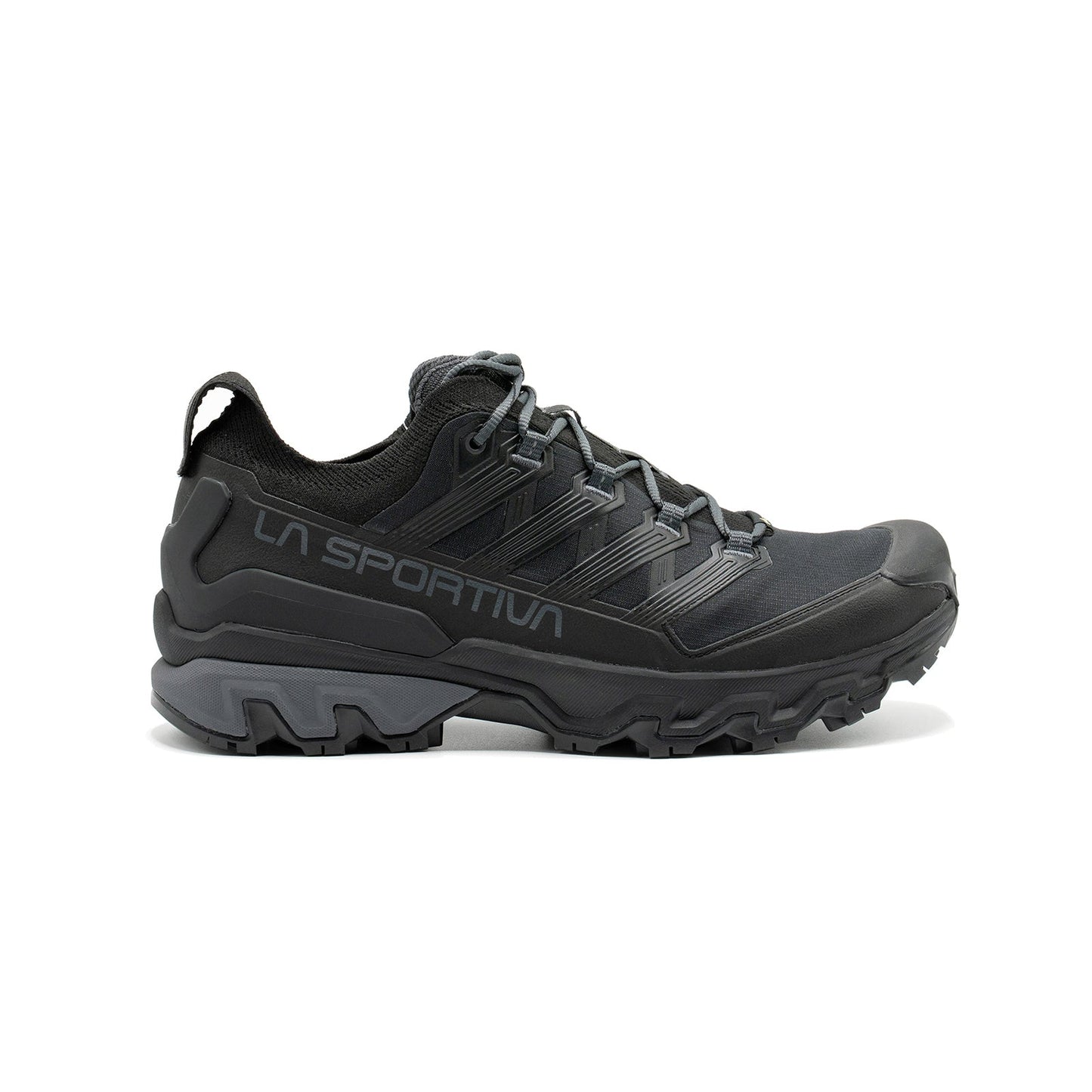The La Sportiva Ultra Raptor 3 GTX is a black waterproof hiking shoe featuring rugged tread, mesh upper, reinforced toe, and lace-up closure, designed for trail-running agility on outdoor adventures and rough terrain.