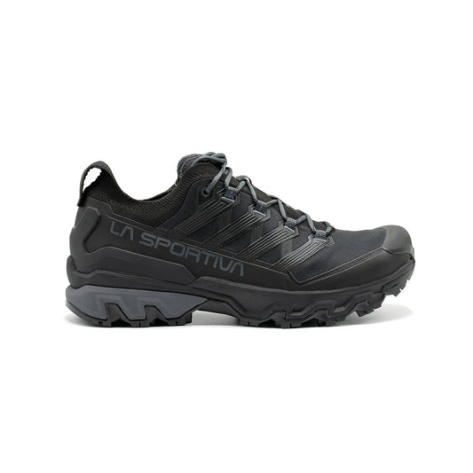 The La Sportiva Ultra Raptor 3 GTX is a black waterproof hiking shoe featuring rugged tread, mesh upper, reinforced toe, and lace-up closure, designed for trail-running agility on outdoor adventures and rough terrain.