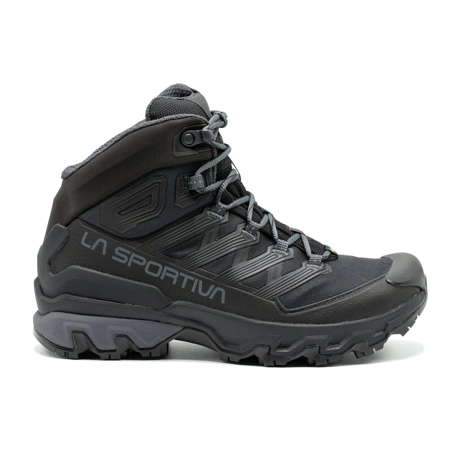 The La Sportiva Ultra Raptor 3 Mid GTX Women's is a black and dark gray waterproof hiking boot with a rugged sole, high ankle support, and laces, shown in a side view.
