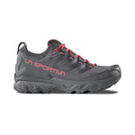 The La Sportiva Ultra Raptor 3 GTX Women's hiking shoe is gray with pink accents, including the brand name and laces. It features Gore-Tex technology and is displayed on a white background.