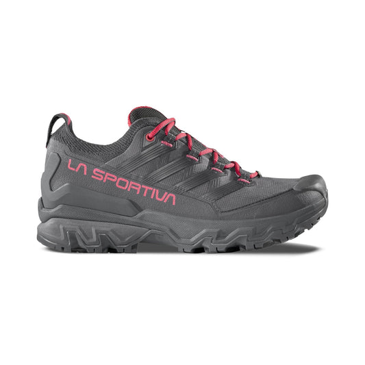 The La Sportiva Ultra Raptor 3 GTX Women's hiking shoe is gray with pink accents, including the brand name and laces. It features Gore-Tex technology and is displayed on a white background.