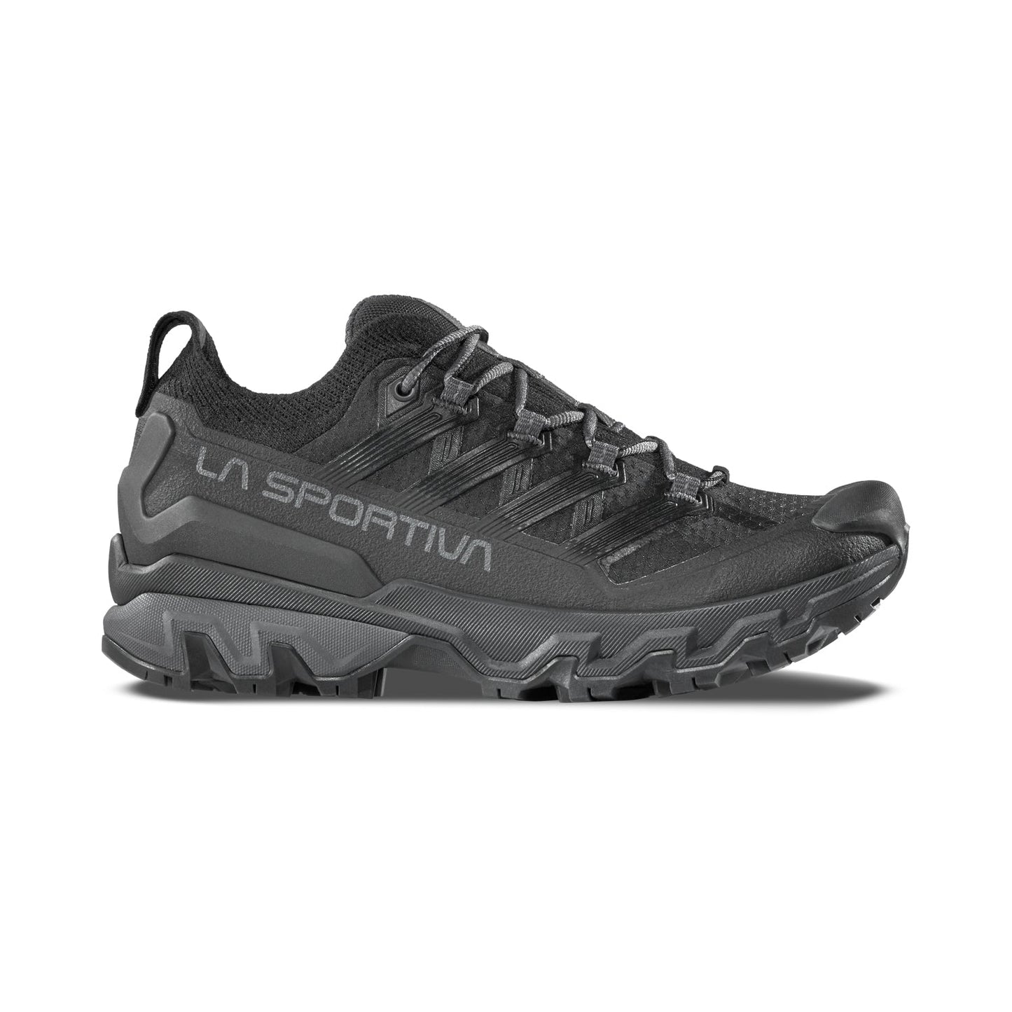 The La Sportiva Ultra Raptor 3 Women's is a black trail running shoe with rugged tread and breathable mesh upper, featuring LA SPORTIVA branding on the side. Displayed in side profile against a white background.