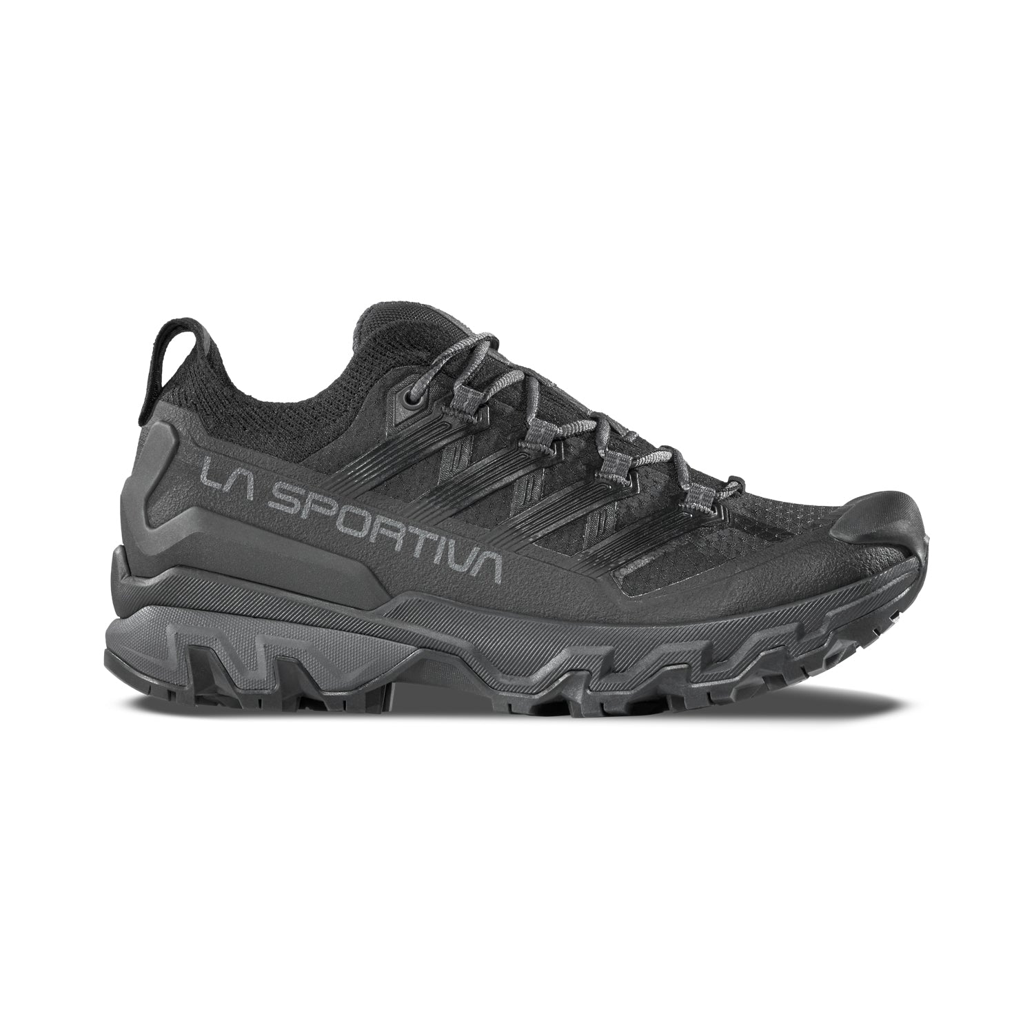 The La Sportiva Ultra Raptor 3 Women's is a black trail running shoe with rugged tread and breathable mesh upper, featuring LA SPORTIVA branding on the side. Displayed in side profile against a white background.