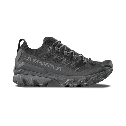 The La Sportiva Ultra Raptor 3 Women's is a black trail running shoe with rugged tread and breathable mesh upper, featuring LA SPORTIVA branding on the side. Displayed in side profile against a white background.
