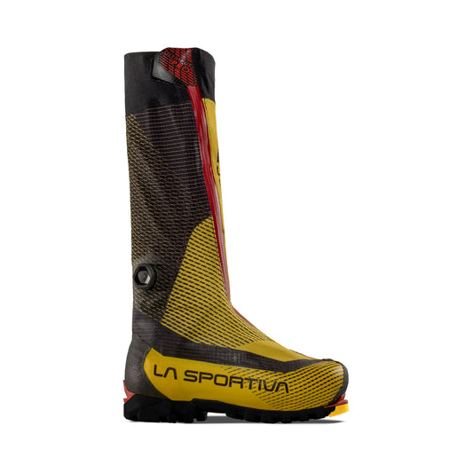 The La Sportiva Olympus Mons Pro is a lightweight, high-altitude mountaineering boot with a tall integrated gaiter in yellow with black and red accents, featuring the LA SPORTIVA logo—ideal for demanding alpine conditions.
