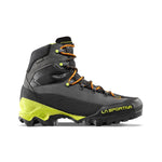 The La Sportiva Aequilibrium LT GTX is a high-cut black and yellow hiking boot with orange laces, rugged tread, textured fabric, and sturdy construction for elite performance. Brand name featured on the side.