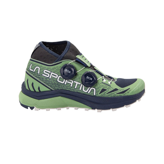 The La Sportiva Jackal II BOA Women's shoe in green and navy, shown side view on white, features dual BOA Fit System dials, signature branding, and a rugged sole ideal for ultra-long distance mountain running.