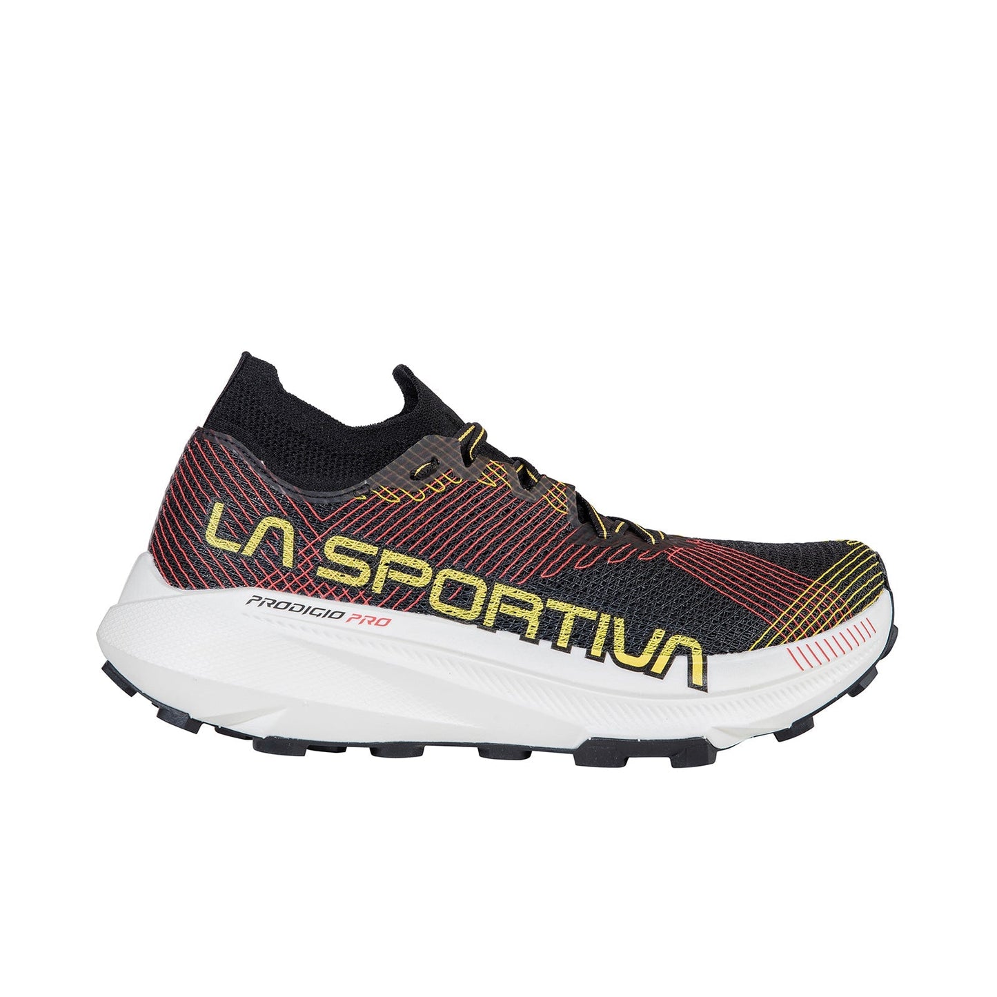 The La Sportiva Prodigio Pro is a black and red trail running shoe with yellow accents, bold branding, a thick white sole with black tread, and a lightweight mesh upper—engineered for pro performance trusted by ultra runners.