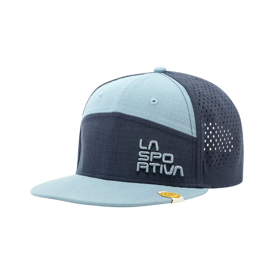 The La Sportiva Traverse Trucker is a two-tone blue mesh snapback cap with a flat brim, an adjustable fit, "LA SPORTIVA" embroidered in white on the front, and a small yellow logo tag on the left side of the brim.