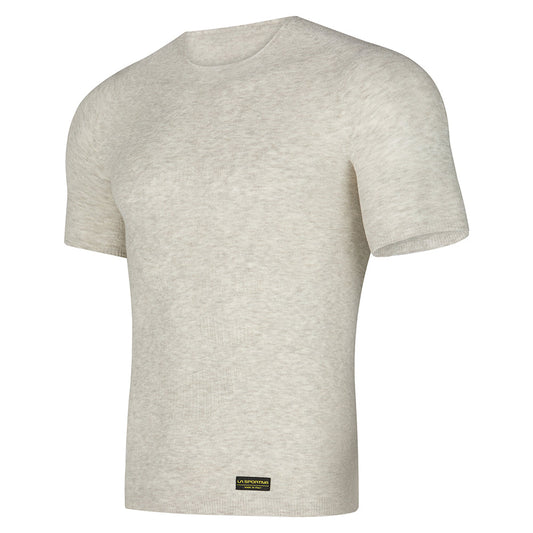 The La Sportiva Silk Reflect T-Shirt is a light beige short-sleeve tee with a round neckline, seamless Native Technology for comfort, and a small black and gold label by the bottom hem, shown on a white background.