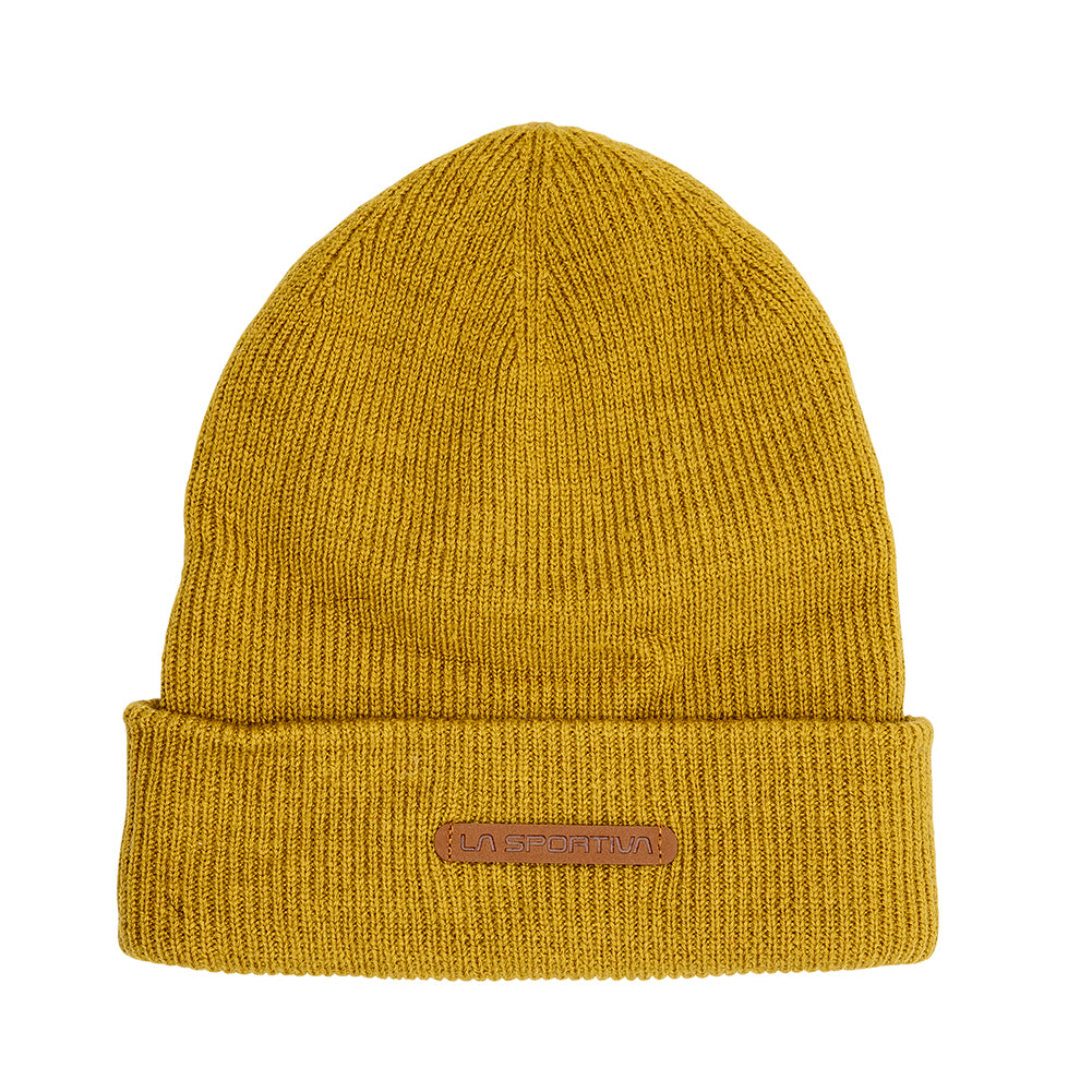The La Sportiva Boulder Beanie is a mustard yellow merino wool hat with a folded brim and brown leather patch logo—perfect for keeping warm on chilly climbing days.